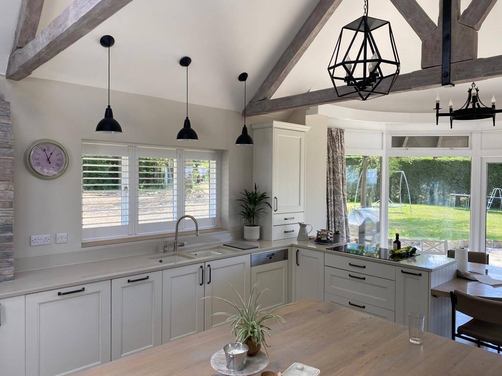 White shutters fitted in a bright kitchen